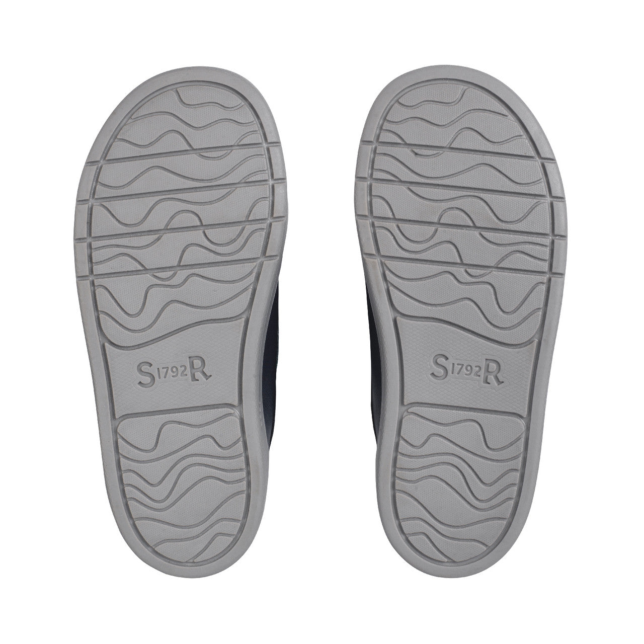 A boys casual school shoe by Start Rite, style Explore, in navy and teal leather with double velcro fastening. Vew of soles of a pair.