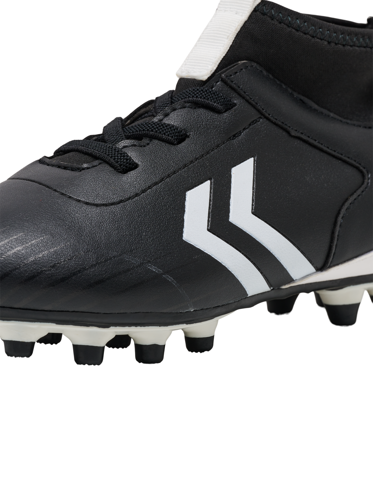 A boys firm ground football boot by Hummel, style Prestige MG JR 216569-2001, in black and white with sock insert and elastic lace fastening. Close up view.