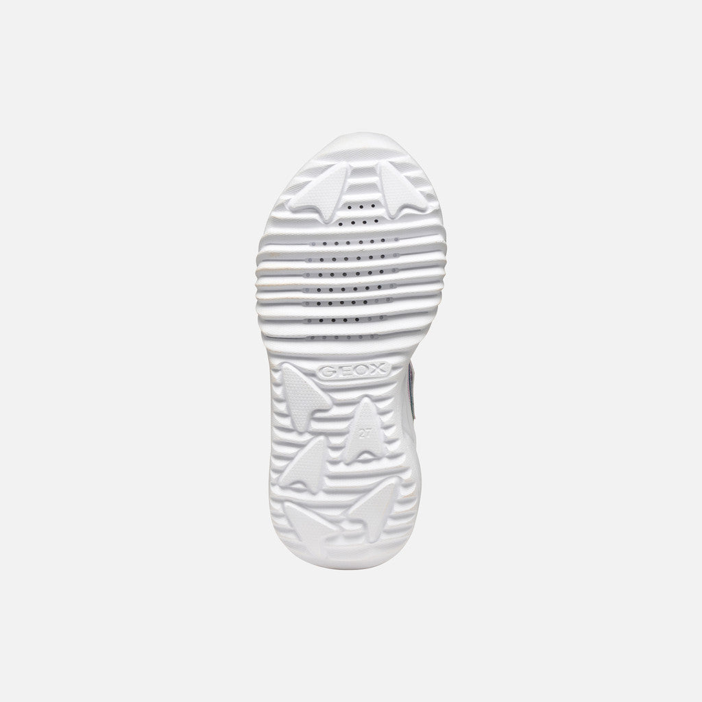 A pink girls trainer by Skechers, style Assister, in pink/multicolour with glittery rainbow and star design, velcro strap and pink laces and white sole. View of sole