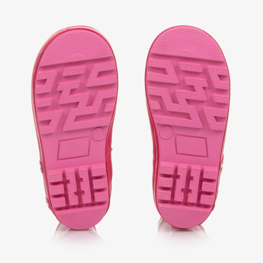 A pair of girls fleece lined wellies by Chipmunks, style Lena, in pink and white with llama design. View of soles.