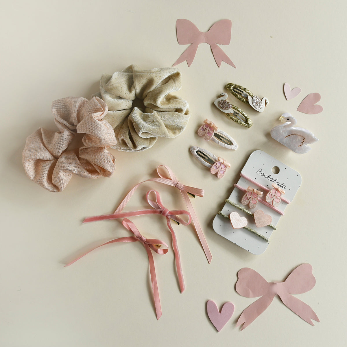 Collection of hair accessories by Rockahula including scrunchies, ribbons, and clips on a light background