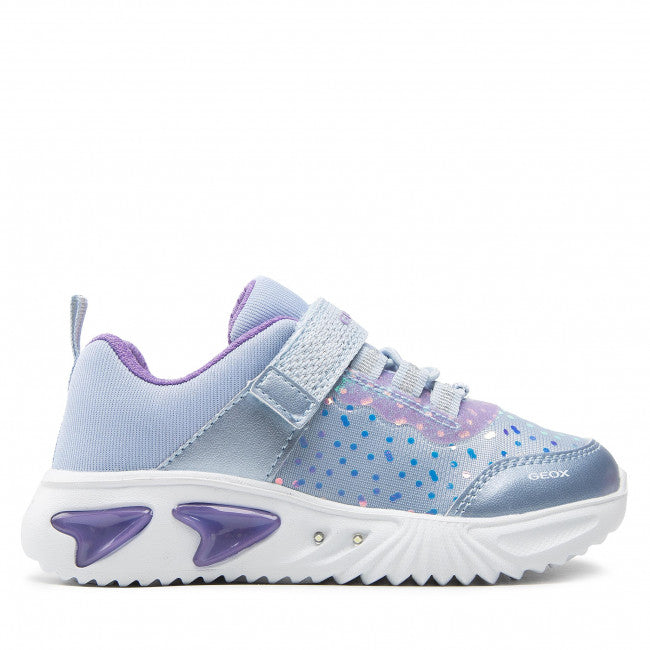 A girls light up trainer by Geox, style J Assister G, in sky blue with violet iridescent print . Velcro / bungee lace fastening and a light up sole. Right side view.t