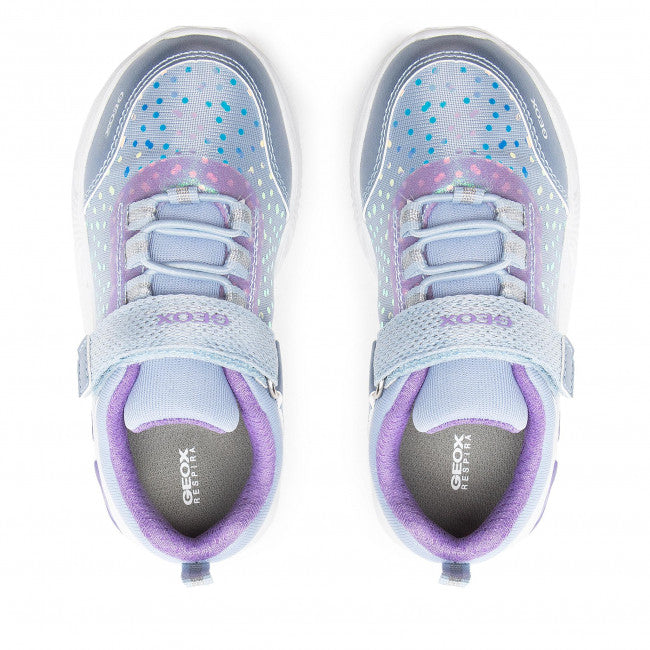 A girls light up trainer by Geox, style J Assister G, in sky blue with violet iridescent print. Velcro/ bungee lace fastening and a light up sole. Above view of a pair.