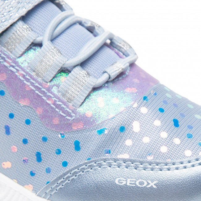 A girls light up trainer by Geox, style J Assister G, in sky blue with violet iridescent print. Velcro/ bungee lace fastening and a light up sole. Close up of print.