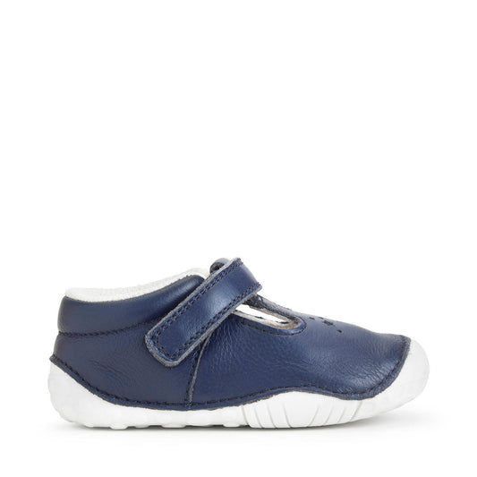 A girls T-Bar pre walker by Start-Rite, style Tumble, in navy leather with white sole, punch out star detail and velcro fastening. Right side view.