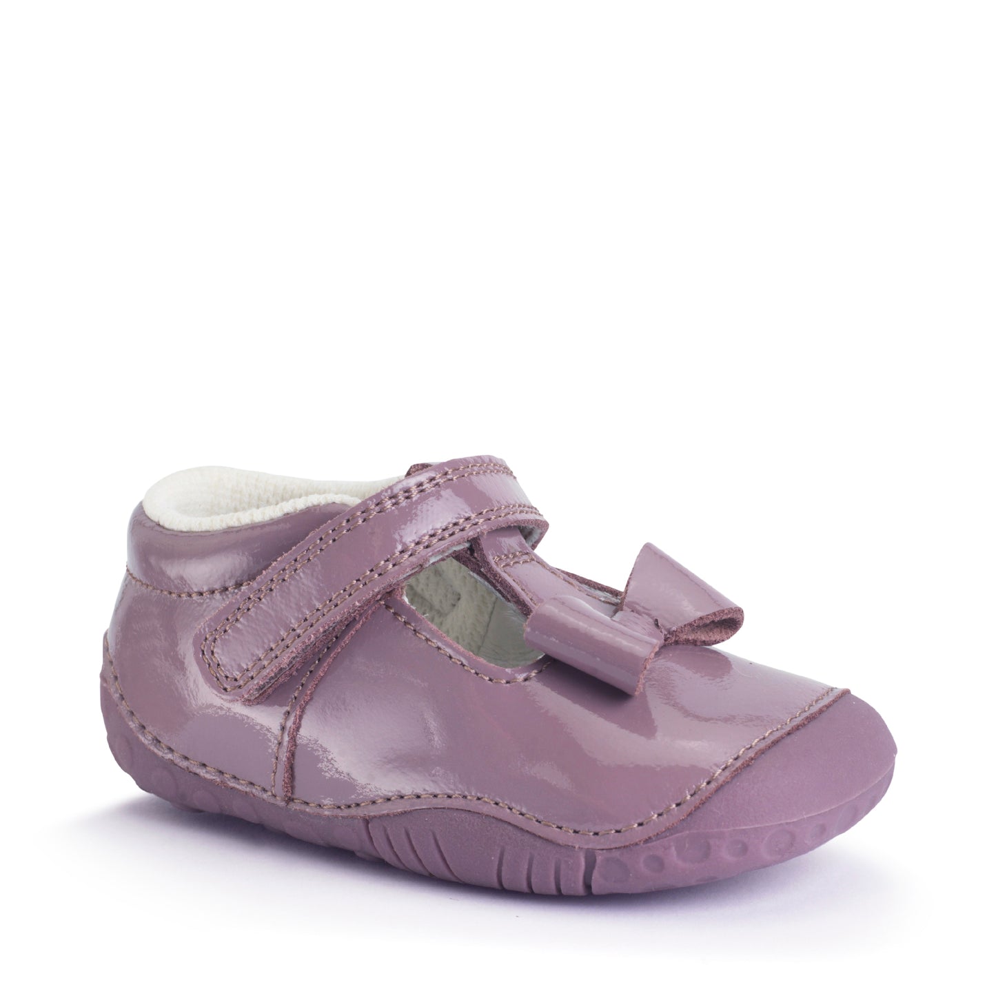 A girls shoe by Start-Rite, stye Wiggle, in mauve with bow detail, with heel and toe bumpers and t bar with velcro strap. Front view