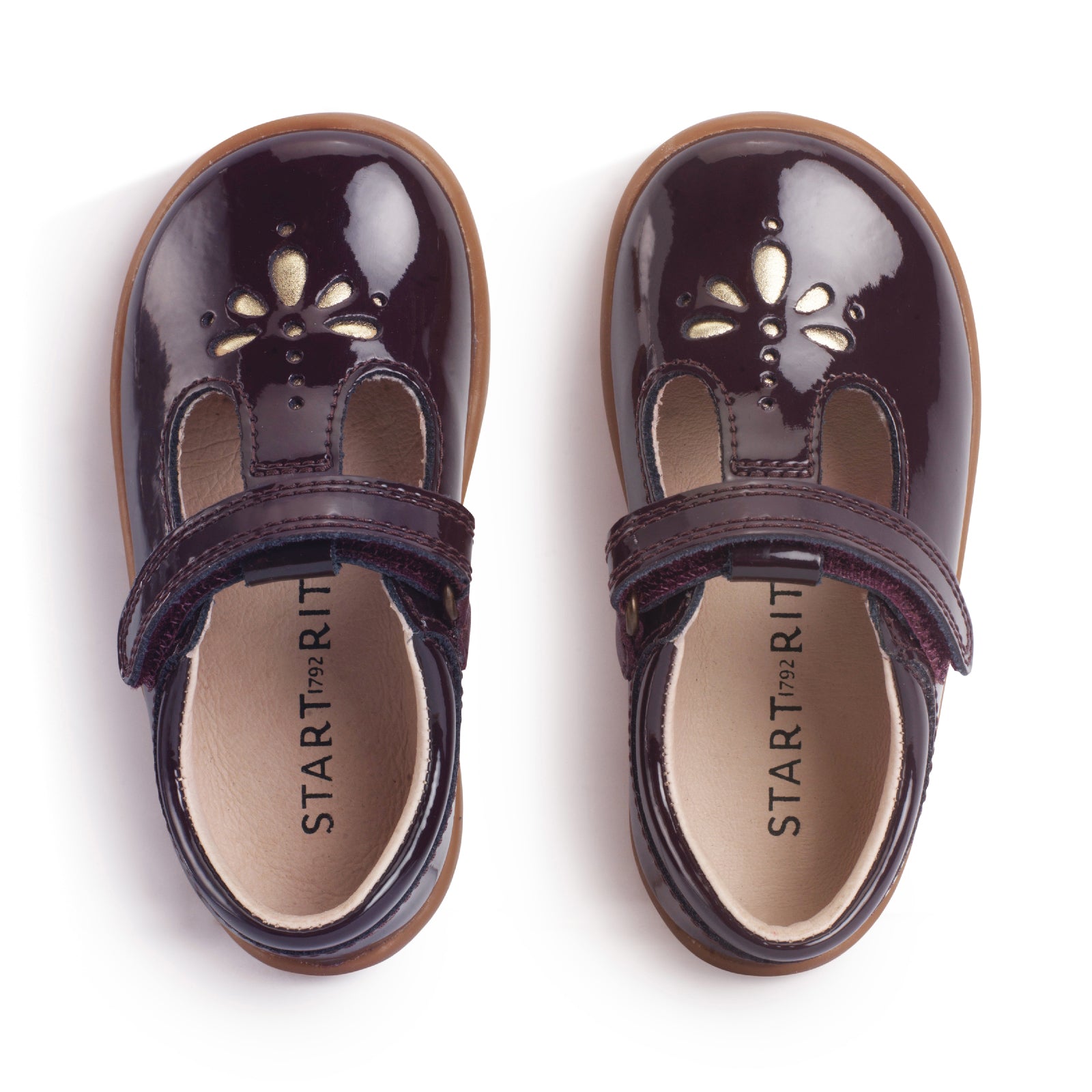 A girls shoe by Start-Rite, stye Puzzle, in burgundy with heel and toe bumpers and t bar with velcro strap. Top view of pair