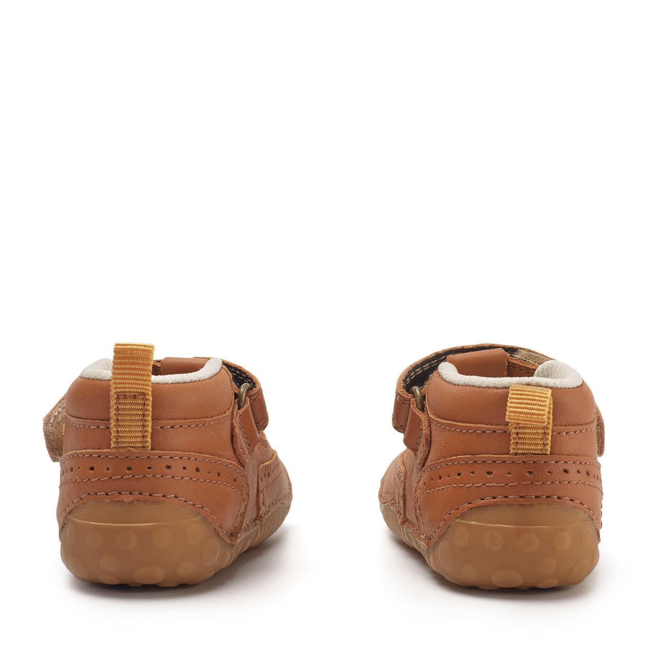 A pair of boys T-Bar pre-walkers by Start-Rite + JoJo Maman Bebe, style Share,in tan leather with brogue detail and toe bumper. Velcro fastening. View from back.