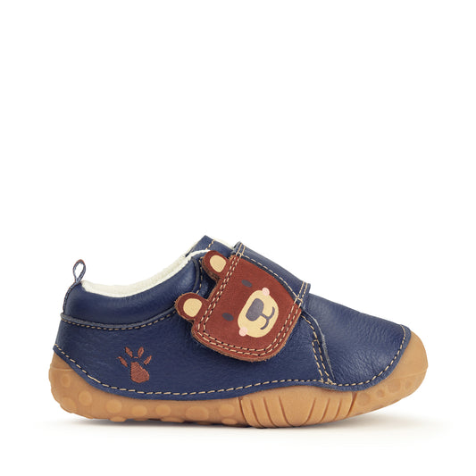 A boy's pre-walker by Start Rite, style Bear Hug,in navy leather with brown paw print detail to side and brown bears face on velcro fastening. Toe bumper. Right side view.