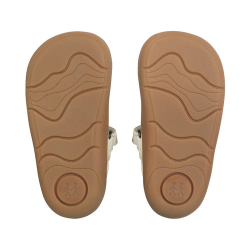 A girls shoe by Start-Rite, style Charms, in dusky pink with t-bar, velcro strap and front and back bumpers. Sole view of pair