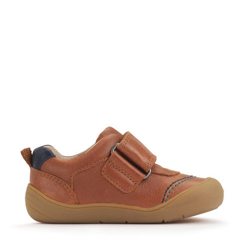 A boys casual shoe by Start-Rite, style Harvest, in tan with heel and toe bumpers and tractor detail to the velcro fastening. Left side view.