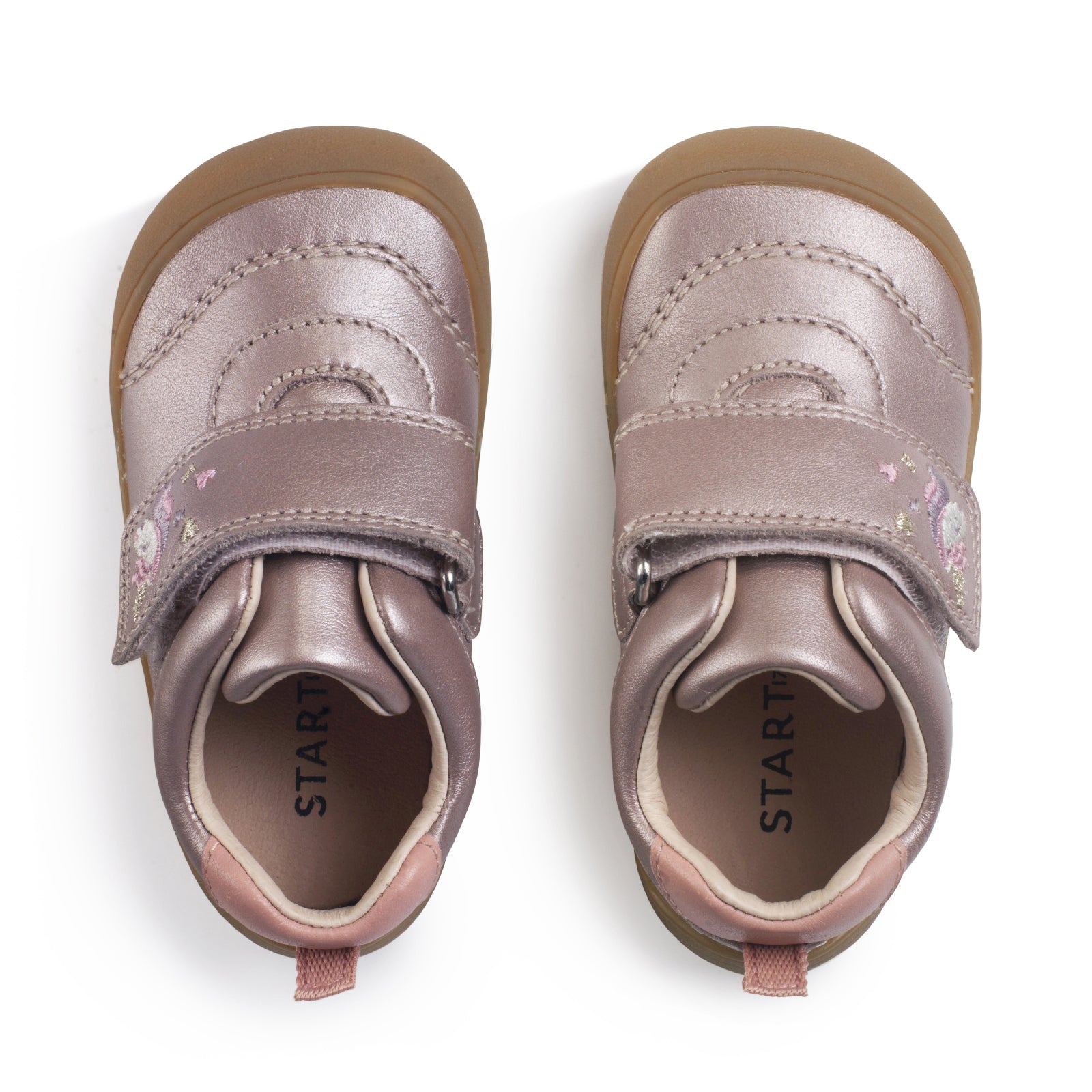 A girls shoe by Start-Rite, stye Moonbeam, in blush/pearlised with wide velcro strap with unicorn design. Top view of pair