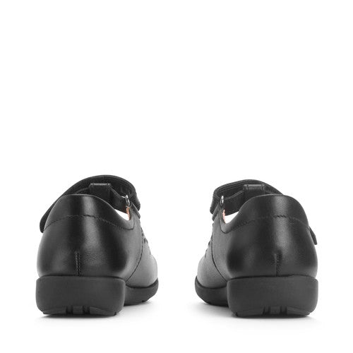 A girls T-bar school shoe by Start-Rite, style Charlotte in black leather with floral punch out detail and velcro fastening. Back view of a pair.