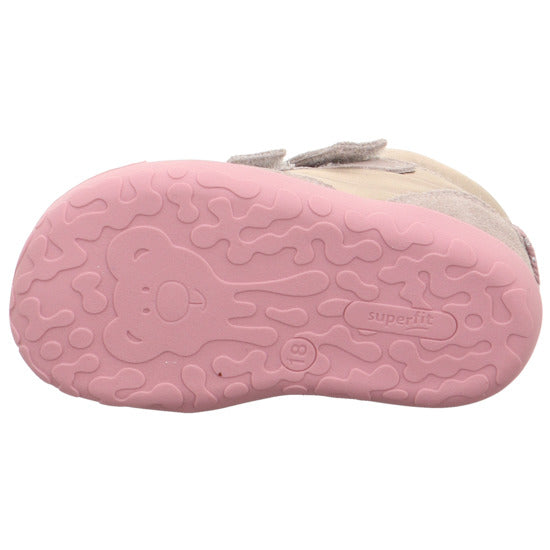 A girls first boot by Superfit, style Flummi 1-009667-4000, in beige and pink with pink sole and double velcro fastening. View of sole showing teddy motif.