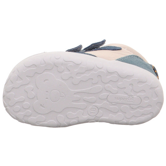 A boys first boot by Superfit, style Flummi 1-009667-8000, in beige and navy with double velcro fastening. View of sole showing teddy motif.
