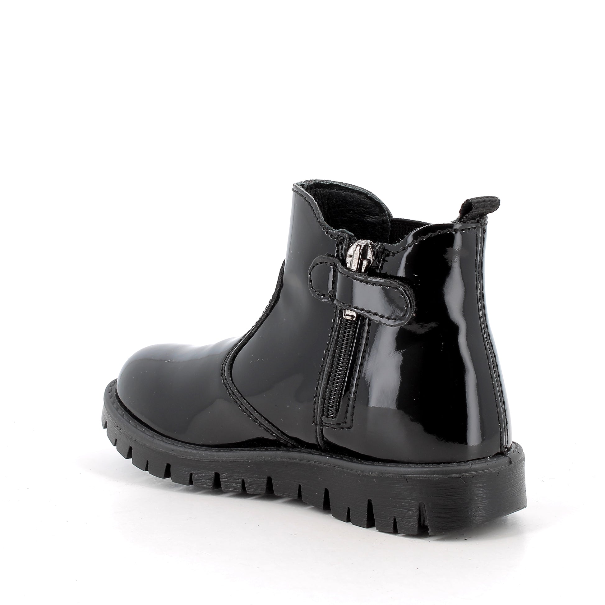 Primigi patent Chelsea boot in black with leopard print detailing on the elastic. Angled back view of zip fastening.