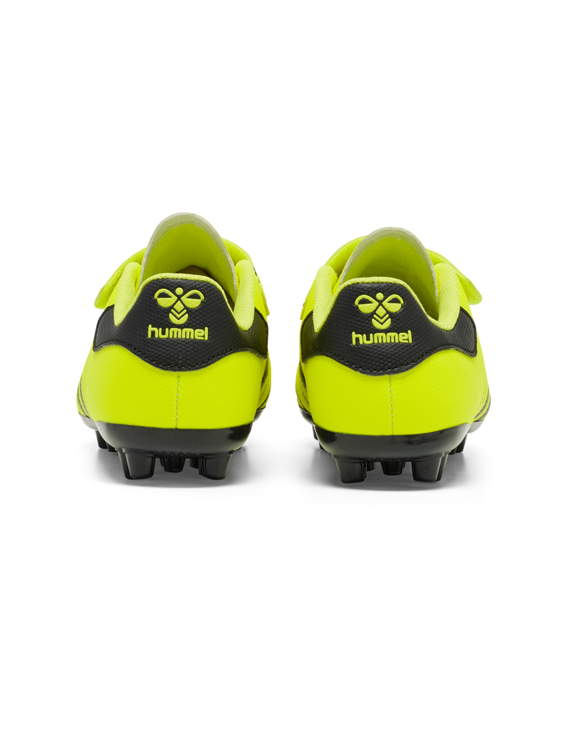 A boys firm ground football boot by Hummel, style Hattrick MG JR 217580-5998, in neon yellow with velcro fastening. Back view of a pair.