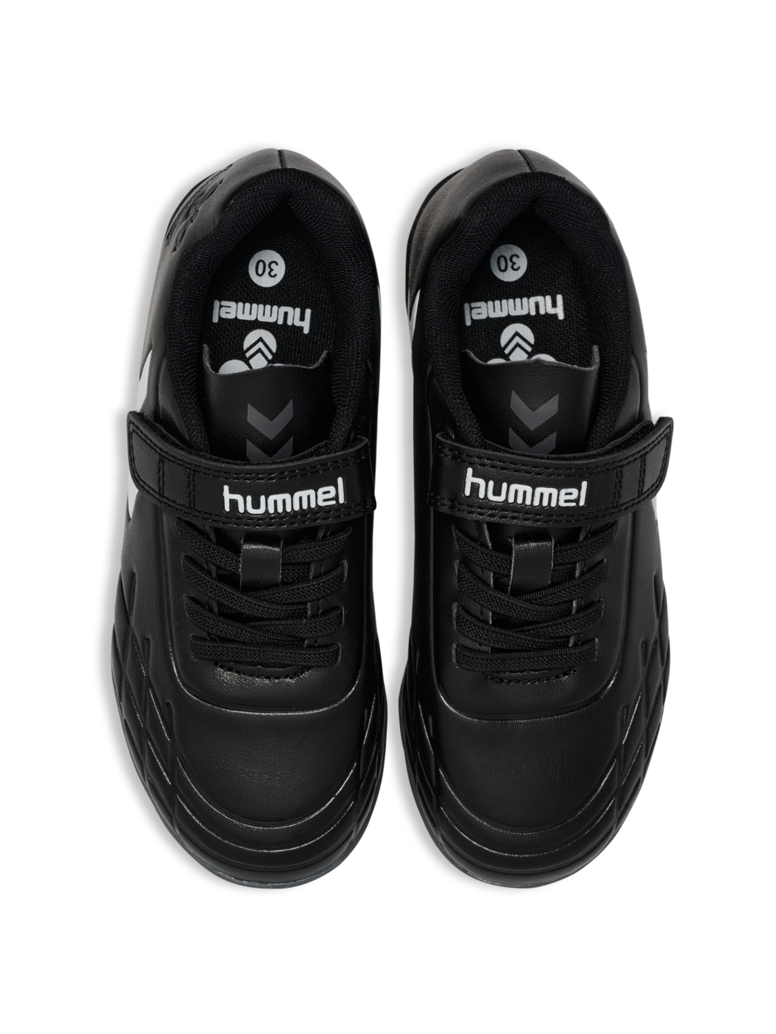 A astro turf football boot by Hummel, style Top Star Turf JR 228343-2267 in black with white trim with velcro fastening. View of a pair from above.