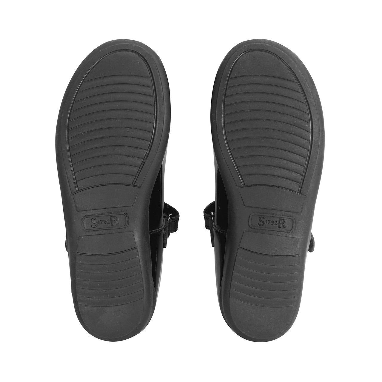 A girls T bar school shoe by Start-Rite, style Gem, in black patent with heart stone and embroidered detail. velcro fastening. View of soles.