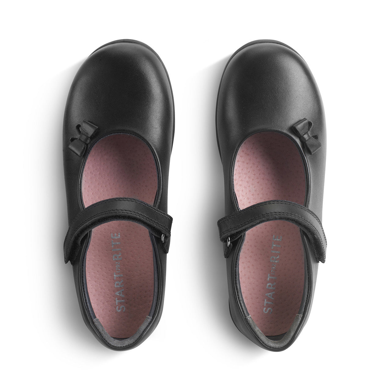 A girls Mary Jane school shoe by Start-Rite, style Ribbon, in black leather with bow detail and velcro fastening. Above view of pair.