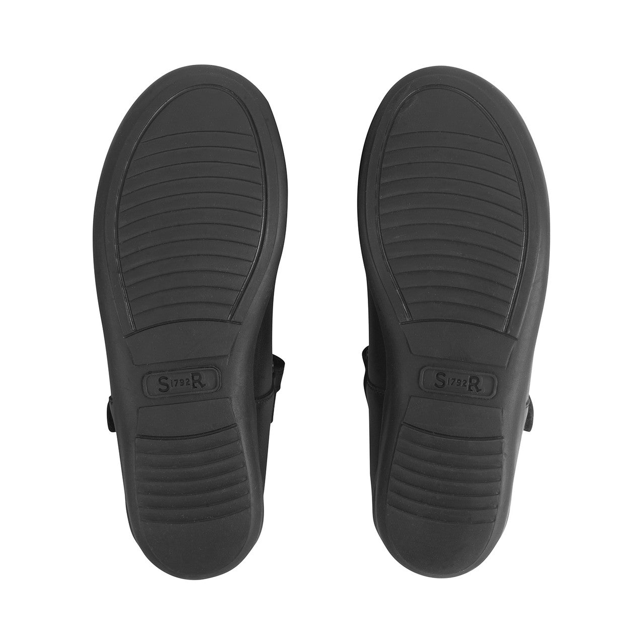 A girls Mary Jane school shoe by Start-Rite, style Ribbon, in black leather with bow detail. Velcro fastening. View of soles.