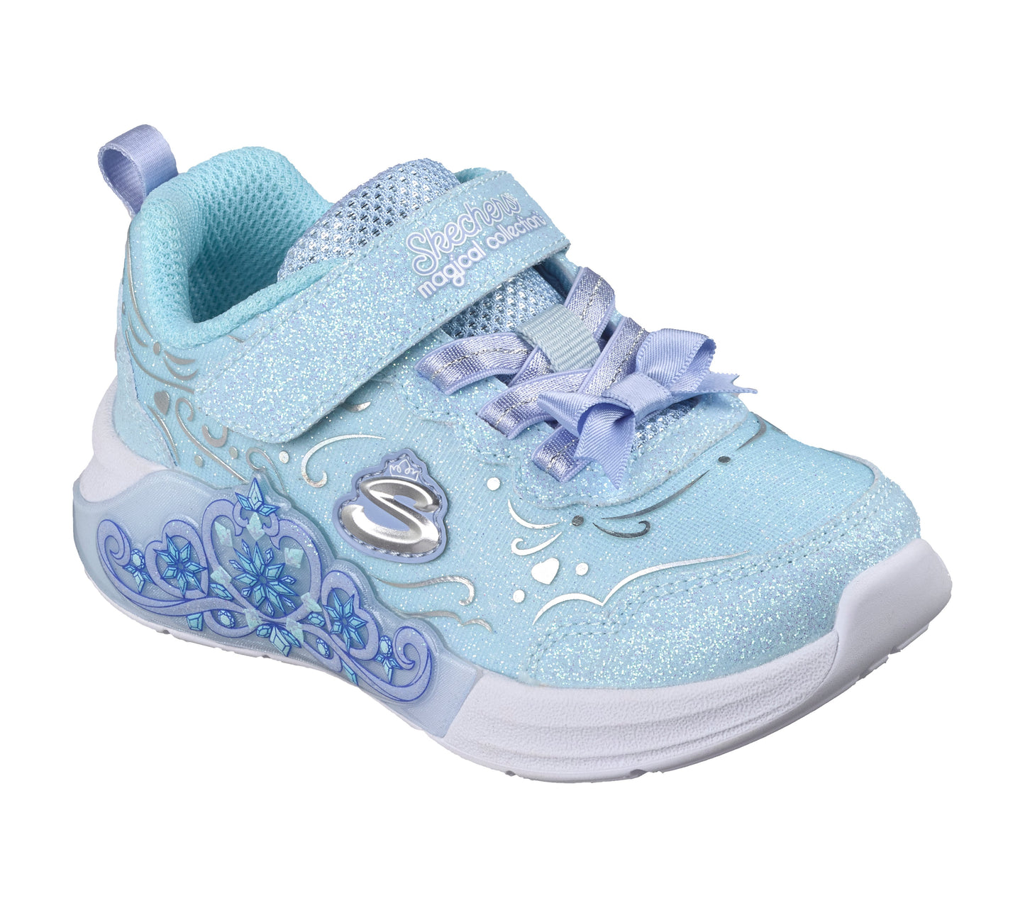 Skechers Lil Princess steps trainer in light blue with decoration on the side, a Velcro strap and white sole. Front right view. 