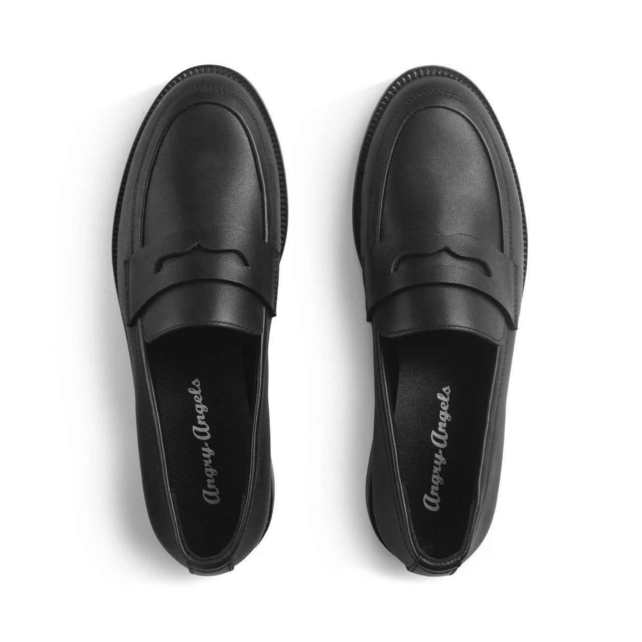 A girls slip on school school shoe by Start Rite, style Milan, in black leather with small heel and Angry Angels branding on insoles. View of a pair from above.