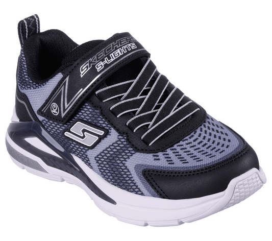 Skechers S Lights Tri-Namics, a boys light-up trainer in black with grey/black textile print, featuring Skechers branding. Velcro fastening with flat bungee laces. Right angled view.