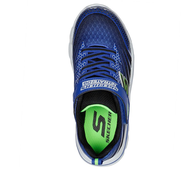 A boys trainer by Skechers, style Nitrate Zulvox, in Royal Blue and Black with stretch lace and velcro fastening. View from above.