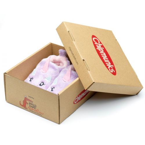 A pair of pull on girls slippers by Chipmunks, style Rainbow, with unicorn design in lilac, white and pink. Angled view of pair in box.