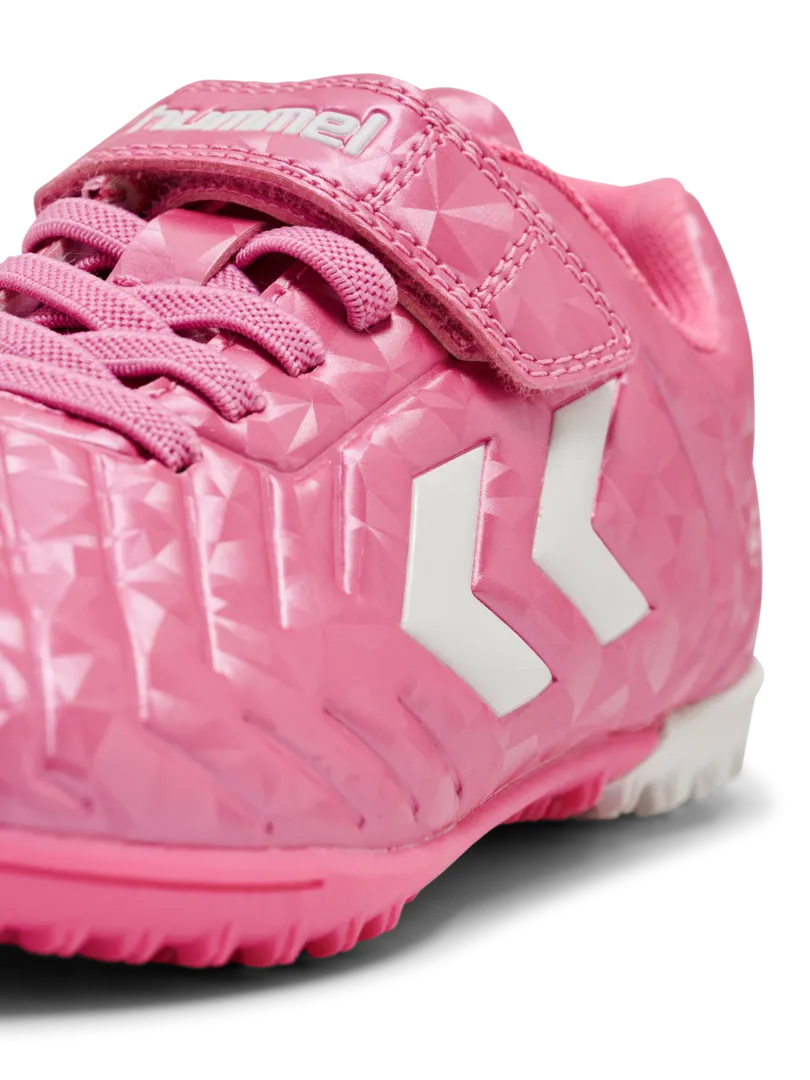 A hard ground/astro turf football boot by Hummel, style Top Star Turf VC 2.0 JR 234863-3924 in Aurora Pink with velcro strap and elastic laces. Zoomed image of branding