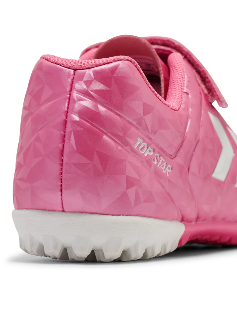 A hard ground/astro turf football boot by Hummel, style Top Star Turf VC 2.0 JR 234863-3924 in Aurora Pink with velcro strap and elastic laces. Zoomed back view