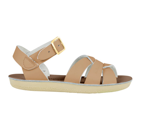Beige sandal with gold buckle on a white background