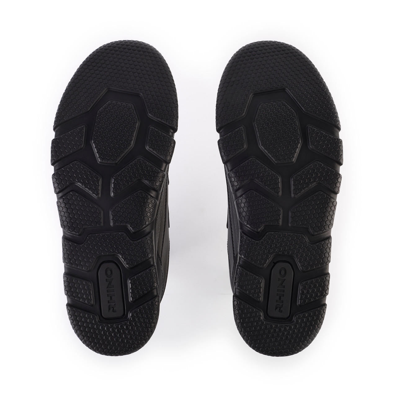 A pair of boys waterproof school shoes by Start Rite, style Trooper, in black leather with double velcro fastening. View of sole.