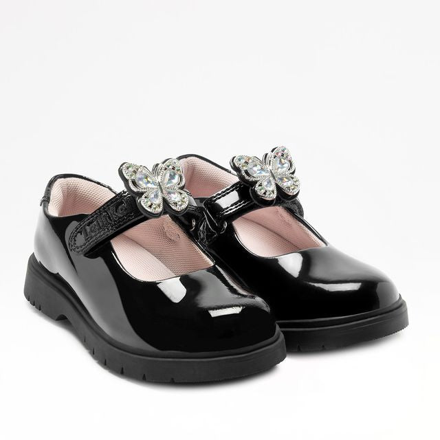 A girls Mary Jane school shoe by Lelli Kelly, style LKSO8964CVR Selena, in black patent with detachable butterfly embellished attachment. Velcro fastening. Angled view of pair.