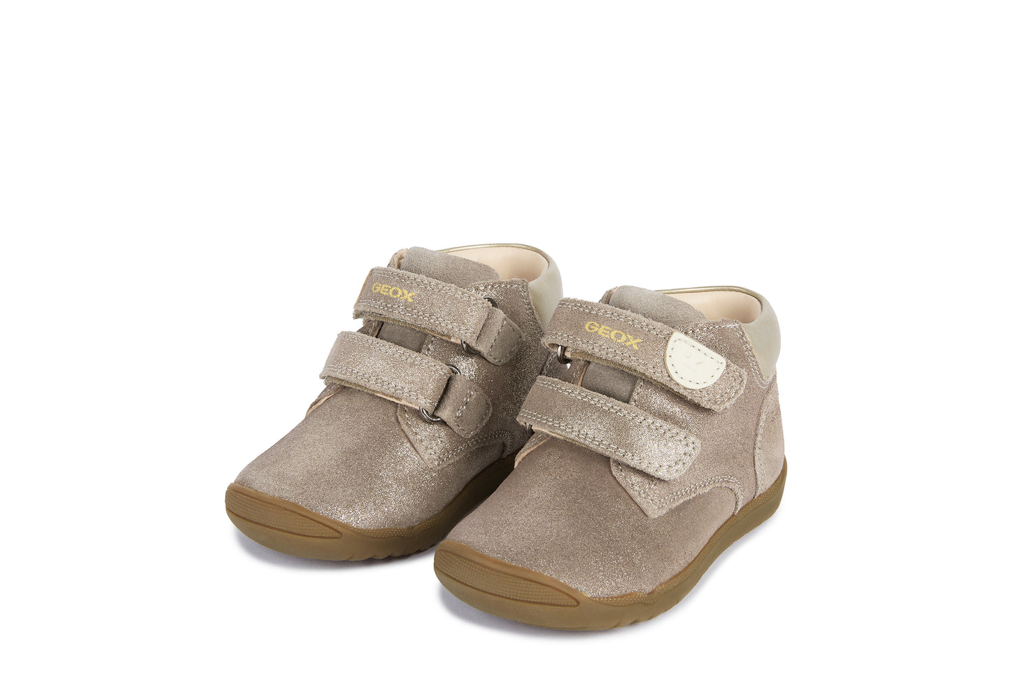 A girls ankle boot by Geox, style Macchia, in smoke grey with two velcro straps and front and heel bumpers. Angled view of a pair.