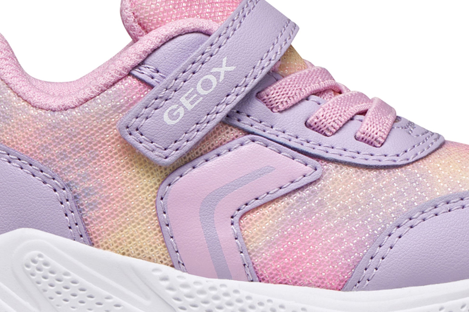 A girls trainer by Geox, style Sprintye in lilac/pik with ombre mesh detailing, velcro strap and elastic laces. Zoomed image of side