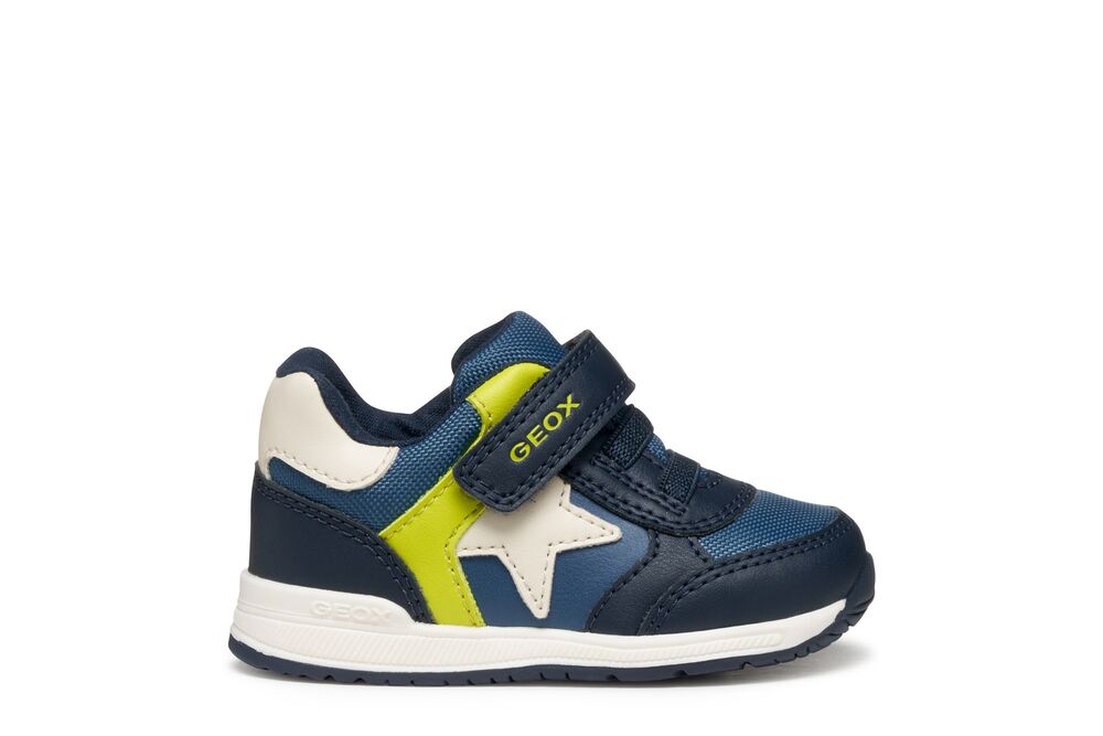 A boys trainer by Geox, style Rishon Boy A, in navy/fluo green, with white star on side, velcro strap and navy laces. Right side view