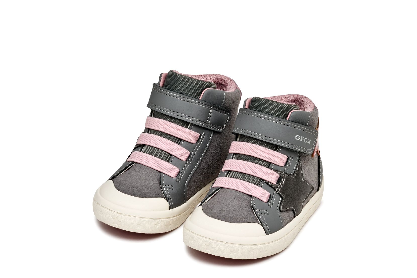 A girls boot by Geox, style Gisli, in grey/pink suede with grey and pink star details on the side, velcro strap and pink laces. Angled view.