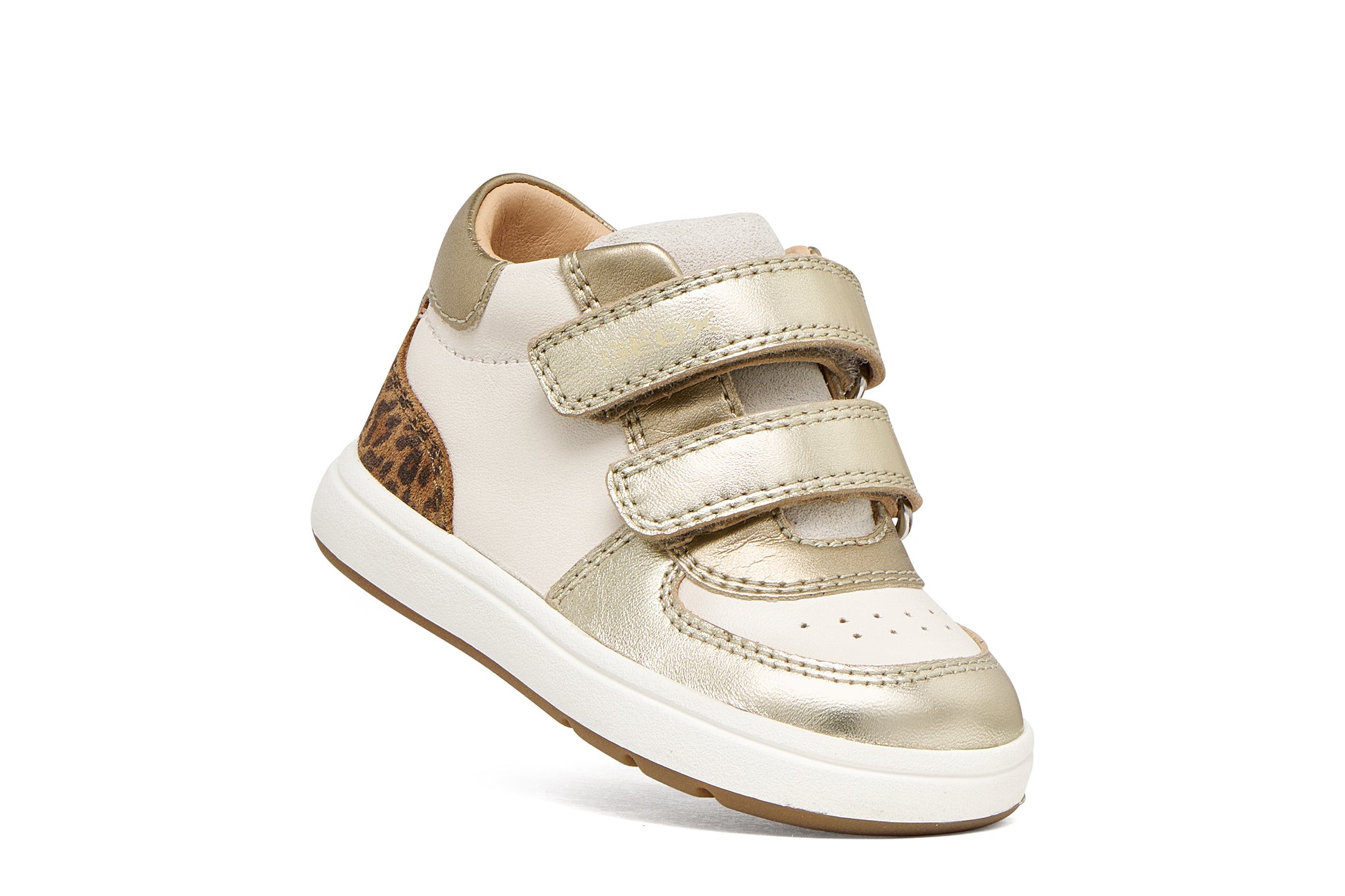 Geox girls trainer in the style Biglia in the colour ivory, with light gold details including a double Velcro strap, leopard print detailing on the heel and an ivory and gold sole. Right side view. 