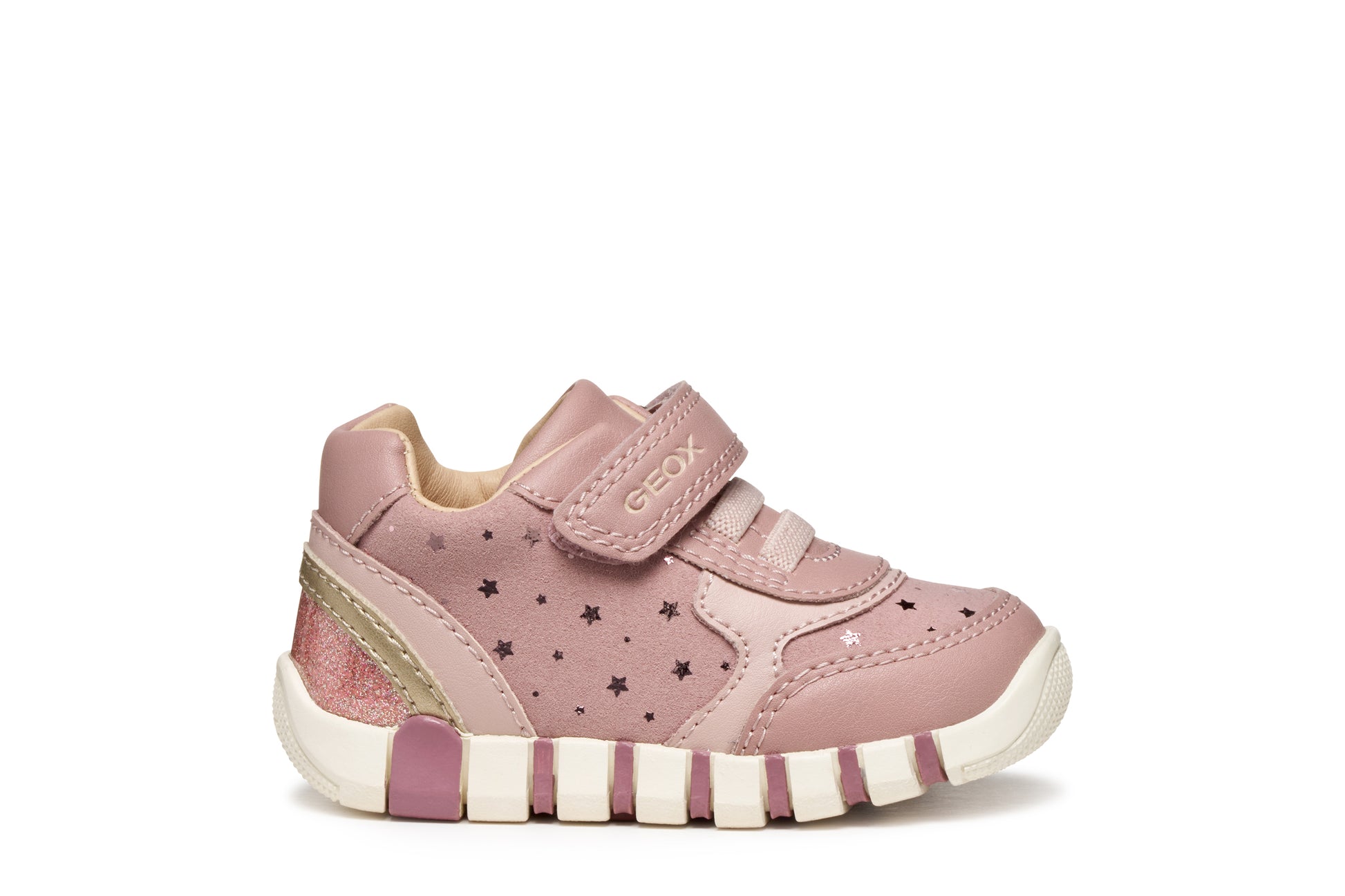 Pink Geox trainer with Velcro strap, star details and a pink and white sole. Outer right side view.