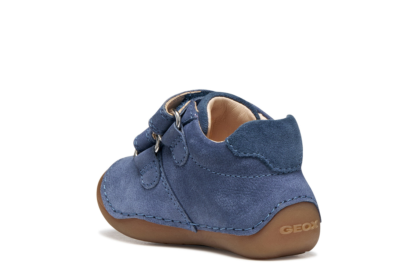 Geox pre-walker shoe in the style Tumtim, in the colour denim blue with a double Velcro strap fastening and gum sole. Angled back view of inner right side shoe.