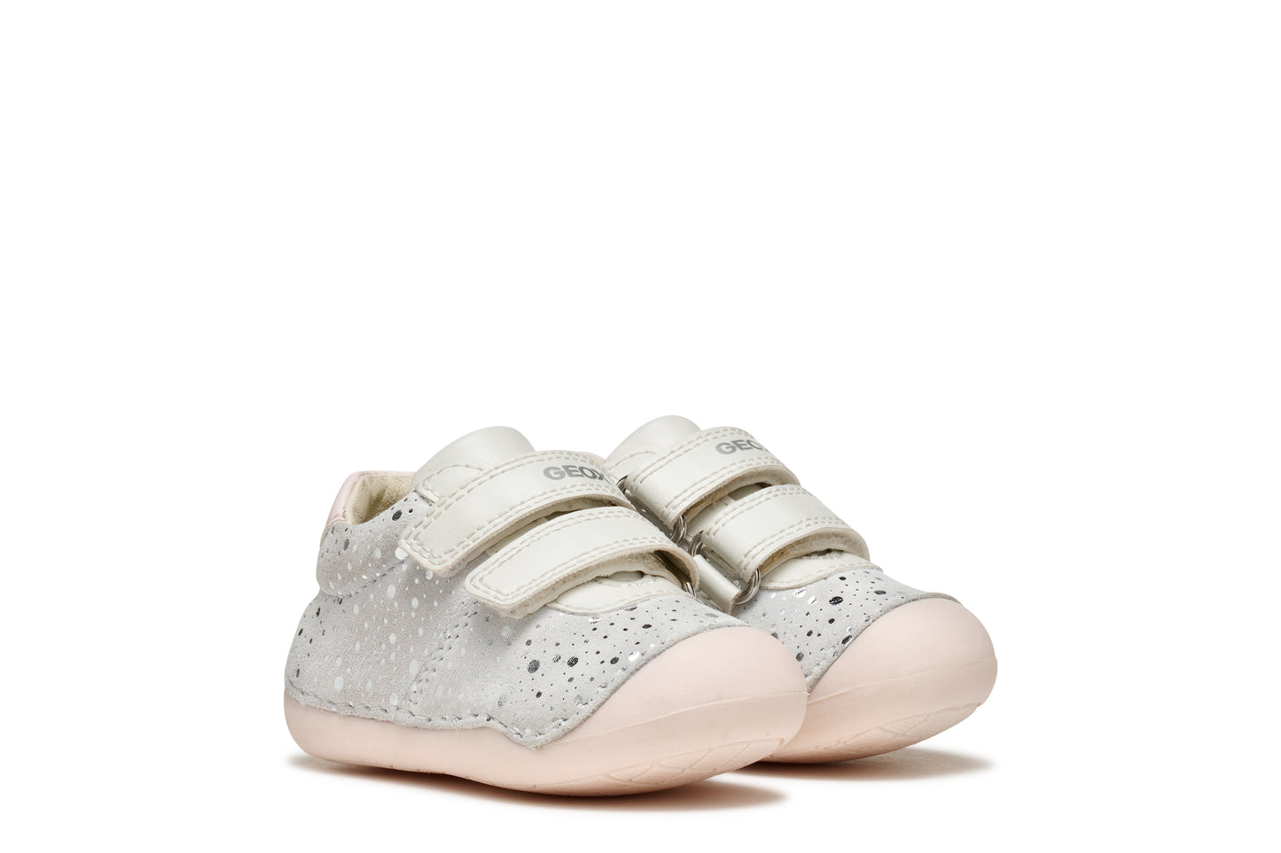 A girls pre-walker shoe by Geox, style Tutim in white/pink with silver speckled design, two velcro straps and toe and heel bumpers. View of pair