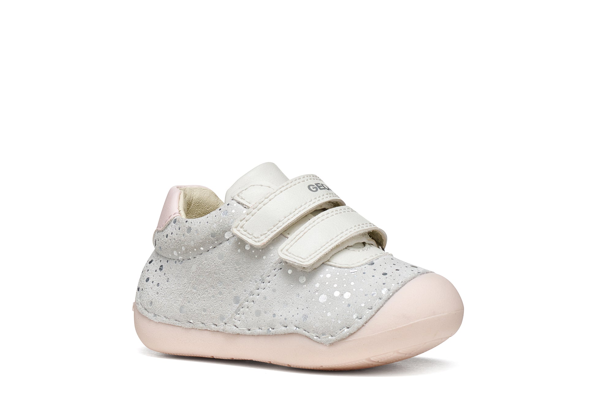 A girls pre-walker shoe by Geox, style Tutim in white/pink with silver speckled design, two velcro straps and toe and heel bumpers. Right side view