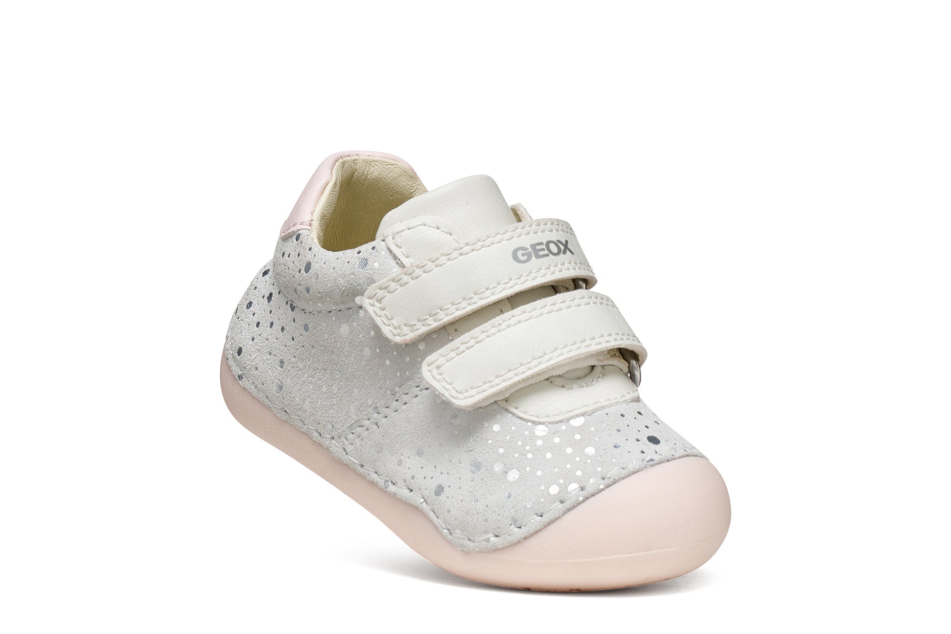 A girls pre-walker shoe by Geox, style Tutim in white/pink with silver speckled design, two velcro straps and toe and heel bumpers. Tilted right side view