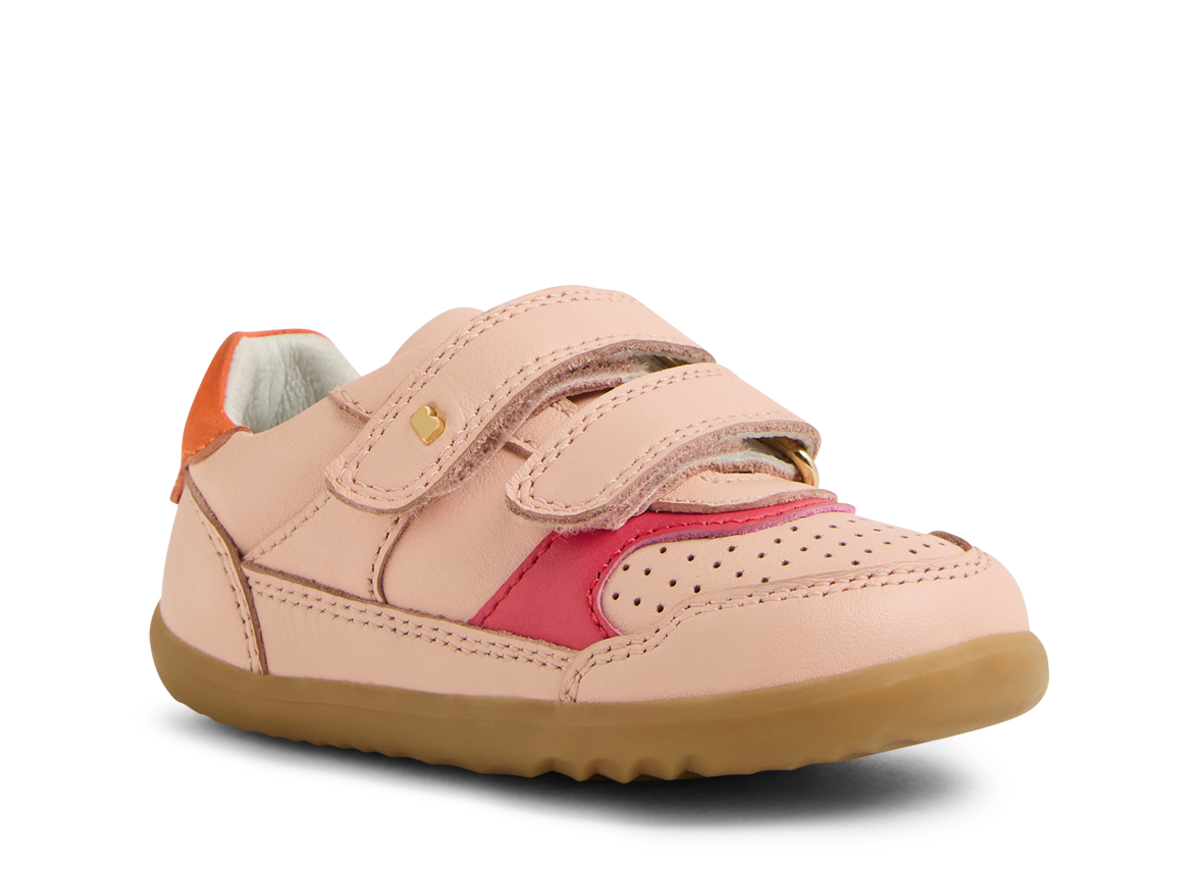 A girls casual shoe by Bobux, style Hunter in pink with bright pink and orange trim and velcro fastening. Angled right side view.
