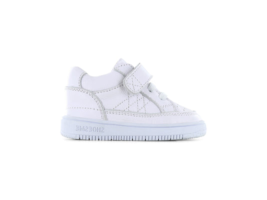 A white unisex trainer by Shoesme, style BN2SLS007-A, in white leather with elastic lace and single velcro fastening. Right side view.