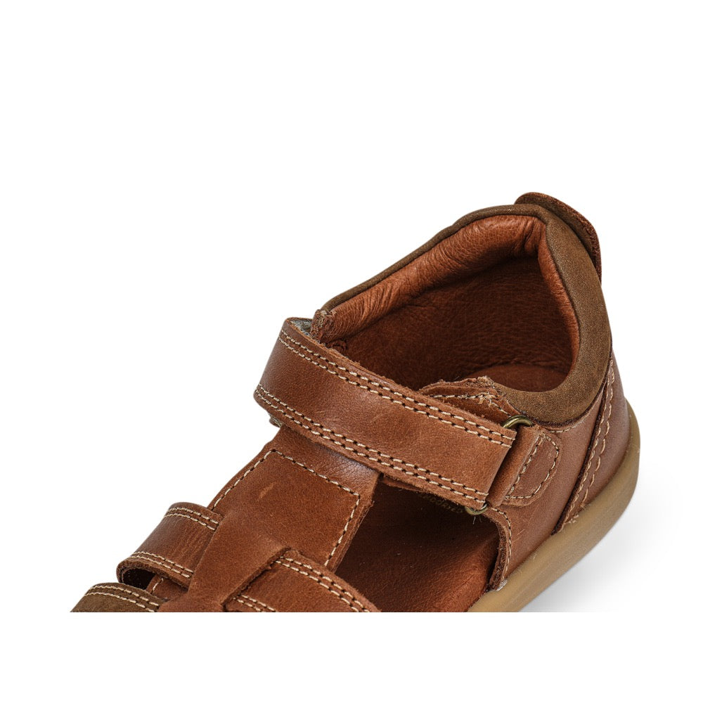 A unisex sandal by Bobux, style Roam in Caramel with velcro strap. Zoomed view of inside ankle
