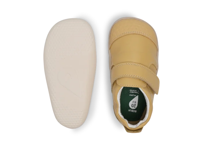 A unisex pre-walker by Bobux, style XP Go, in sand with velcro strap. Above view and sole view.