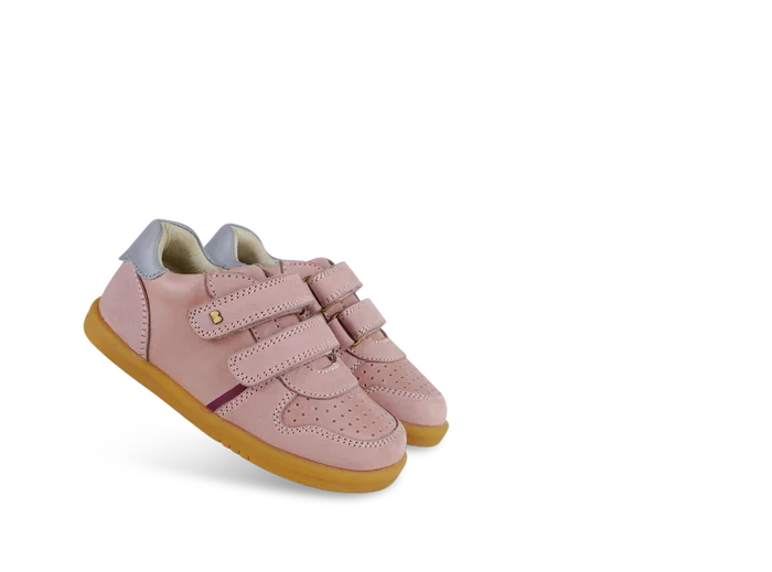 A girls casual full shoe by Bobux, style Riley, double velcro in dusky pink leather and suede. Angled view of a pair.